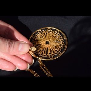 Joan Rivers filigree mandala pendant necklace.